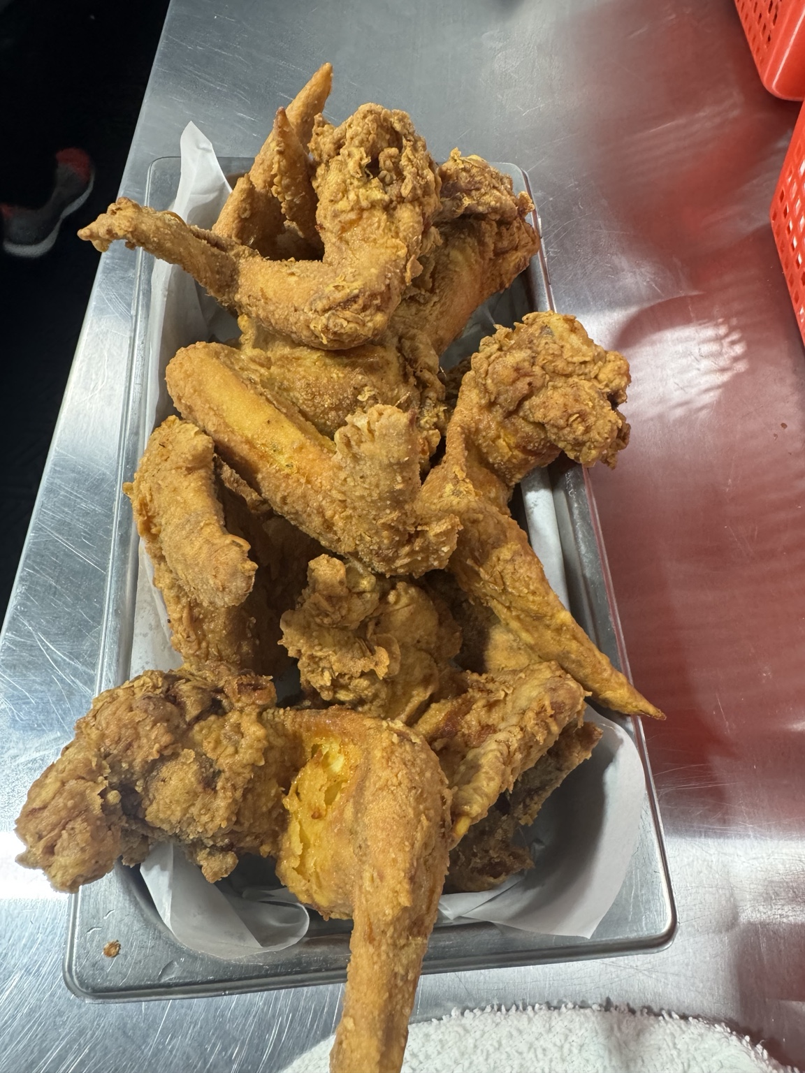 Tray of golden fried chicken wings