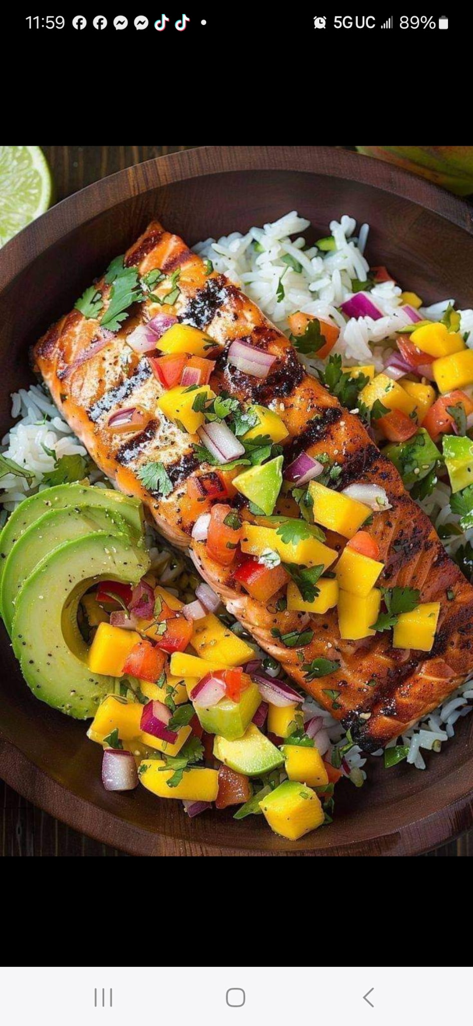 Grilled salmon with rice, avocado and mango salsa