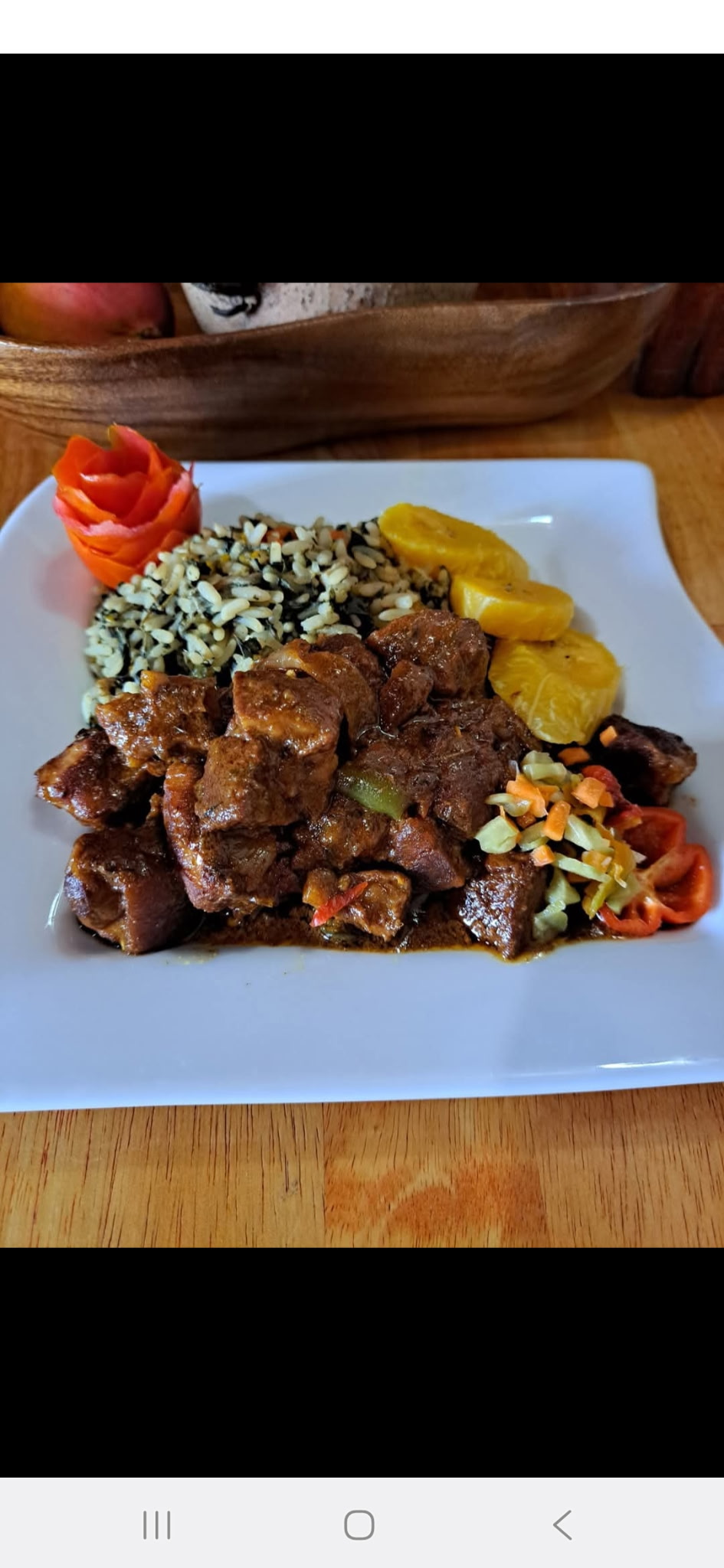 Stewed meat with rice, plantain and vegetables