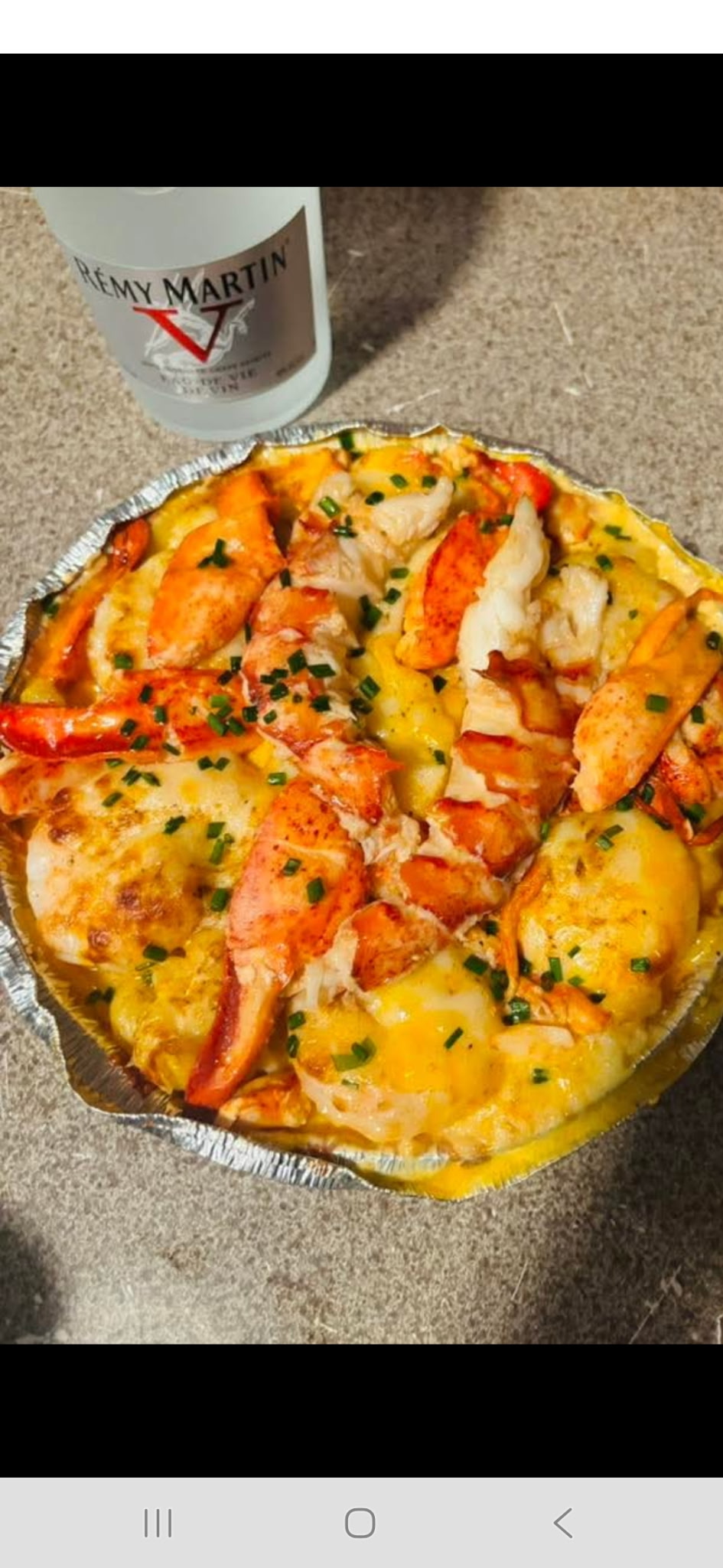 Lobster over golden baked macaroni
